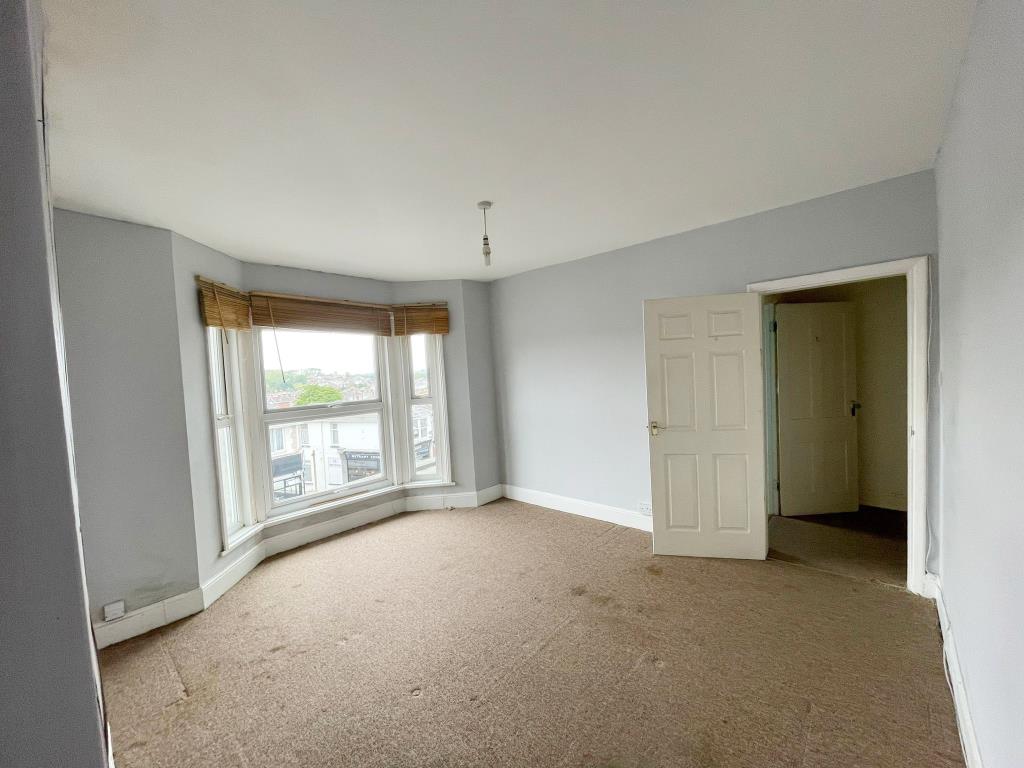 Lot: 11 - THREE-BEDROOM HOUSE FOR IMPROVEMENT - main bedroom with bay window